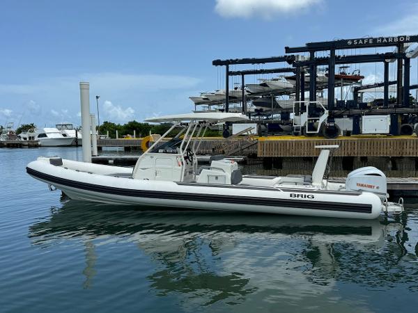 Brig Eagle 10 2022 Brig Eagle 10 boat docked at marina with Yamaha outboard motor.