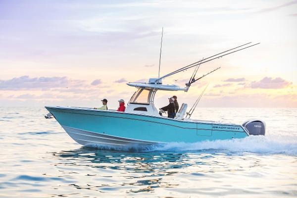 Grady-White Canyon 306 2024 Grady-White Canyon 306 boat cruising on the ocean at sunset.