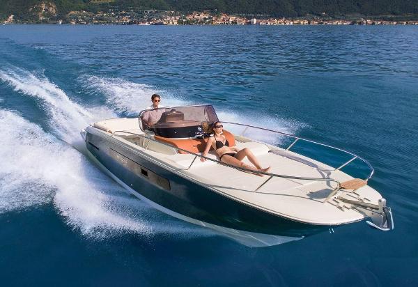Invictus 280 CX 2018 Invictus 280 CX cruising on a serene lake with two passengers onboard.