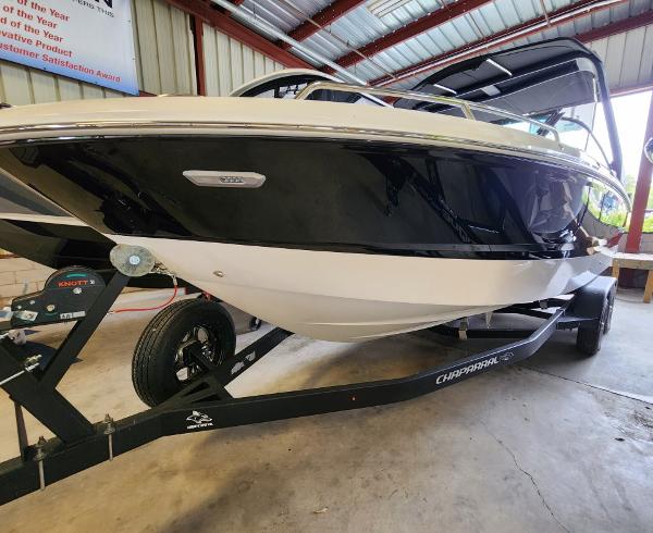 Chaparral 247 SSX 2024 Chaparral 247 SSX boat on trailer in a storage facility.