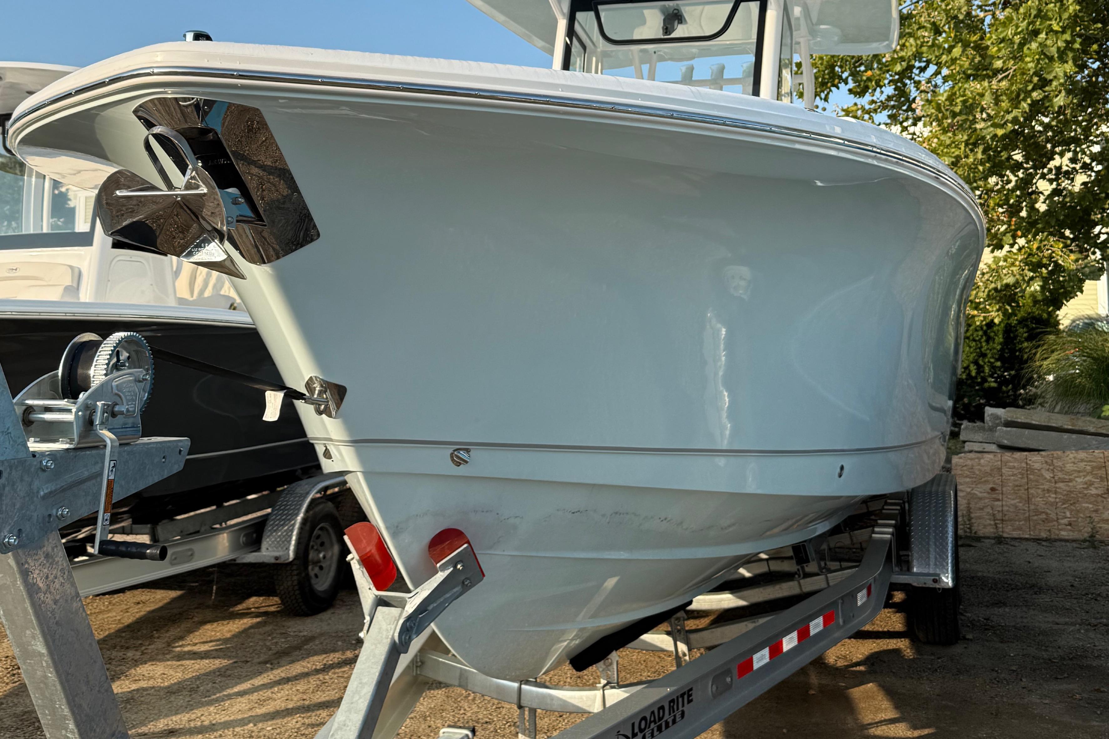 Sea Hunt Gamefish 28 2026 Sea Hunt Gamefish 28 boat on trailer, front view, outdoors.