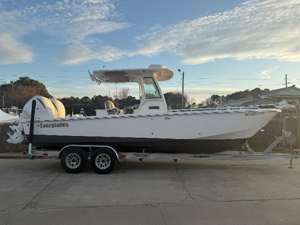 Everglades 273 Center Console 2023 Everglades 273 Center Console boat on trailer, side view.