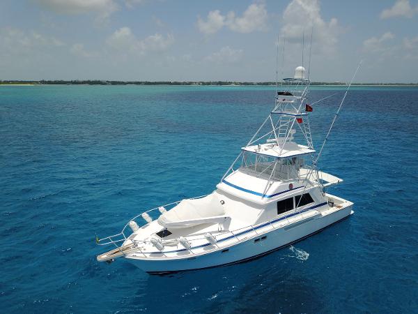 Bertram Convertible 1981 Bertram Convertible yacht cruising in clear blue waters.