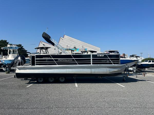 Berkshire 24CL LE 2.75 2024 Berkshire 24CL LE 2.75 pontoon boat on trailer in parking lot.