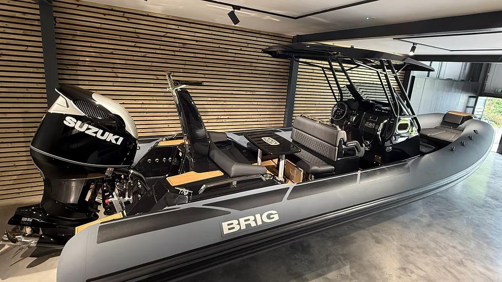 Brig Eagle 8 2025 Brig Eagle 8 boat with Suzuki engine in modern showroom.