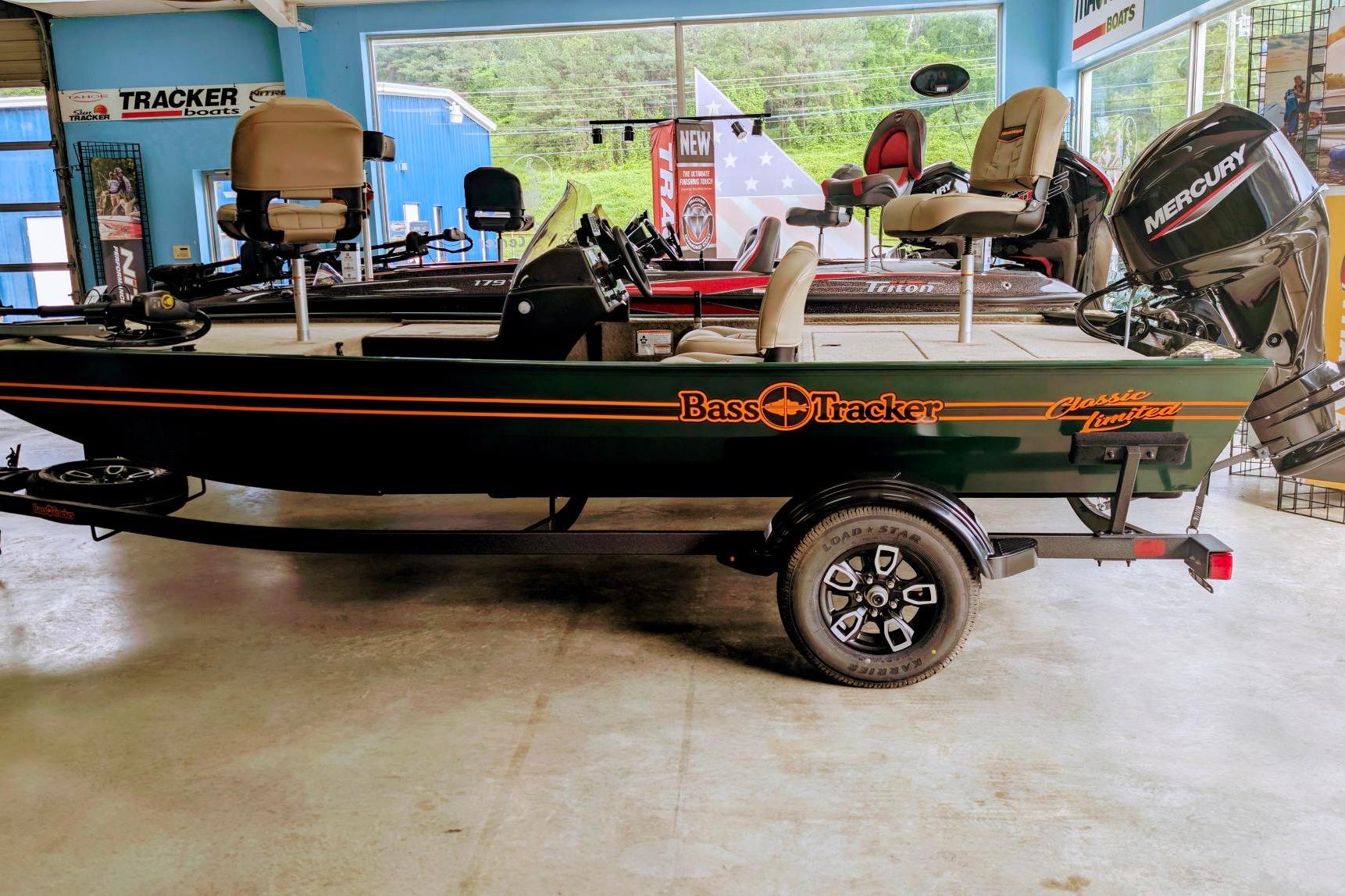 Tracker Bass Tracker Classic Limited 2026 Tracker Bass Tracker Classic Limited boat in showroom, featuring Mercury engine.