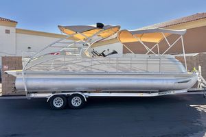 Bennington 2575QCW I/O 2013 Bennington 2575QCW I/O pontoon boat on trailer, featuring dual bimini tops.