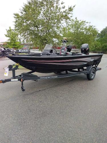 Ranger VS1682SC Angler 2024 Ranger VS1682SC Angler boat on trailer, parked outdoors.