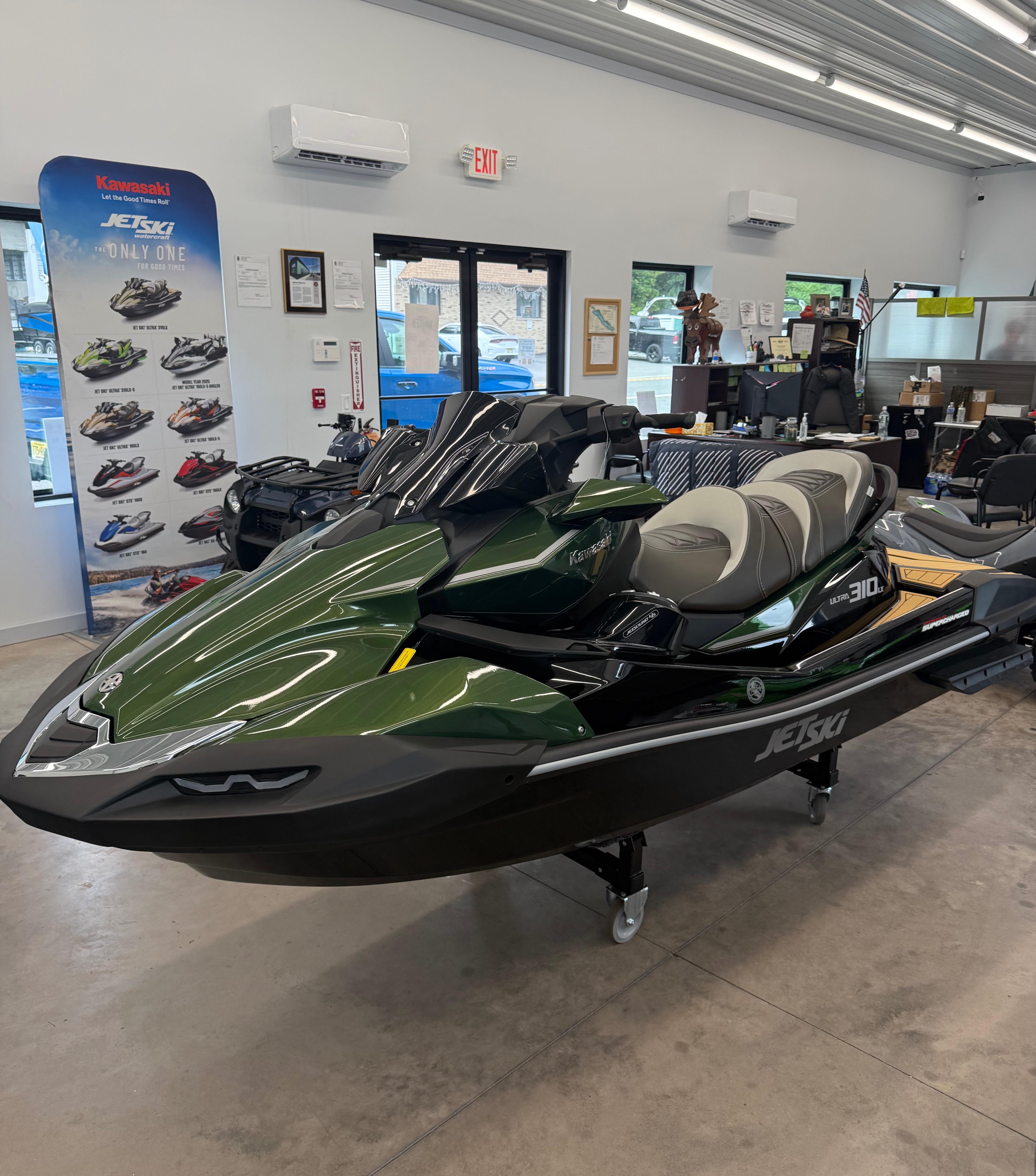 Kawasaki Jetski Ultra 310LX 2025 Kawasaki Jetski Ultra 310LX displayed in showroom, featuring sleek design and modern features.