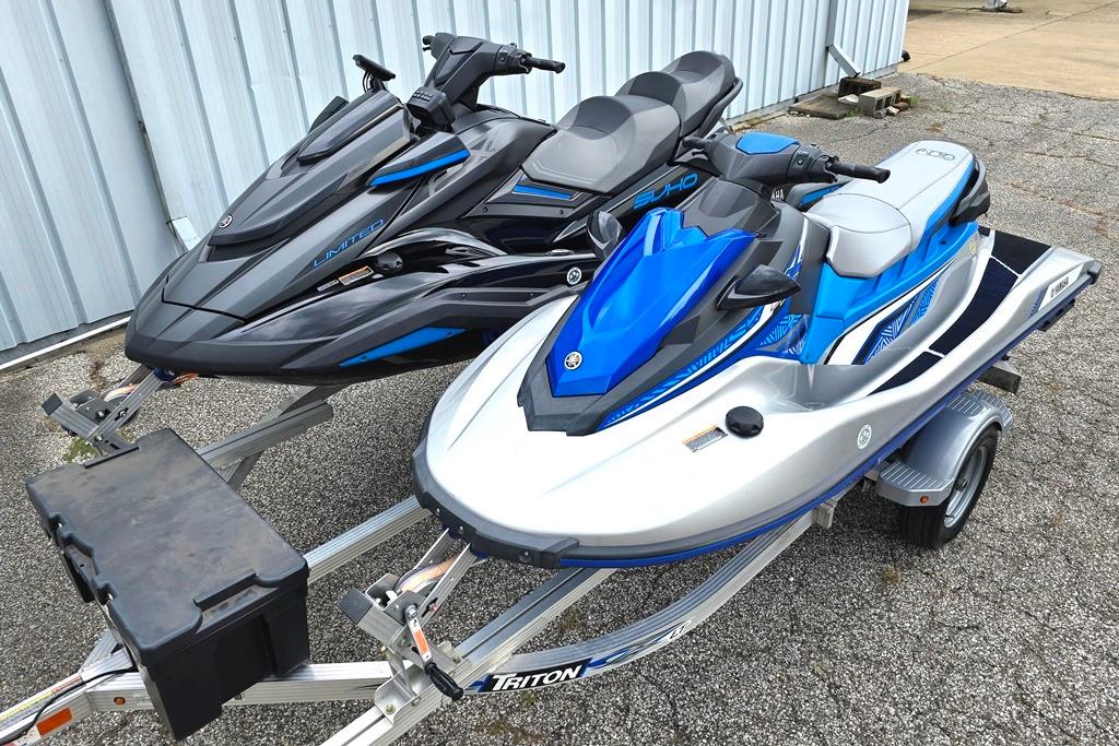 Yamaha WaveRunner WaveRunner Two 2020 Yamaha WaveRunner jet skis on a trailer, parked outdoors.