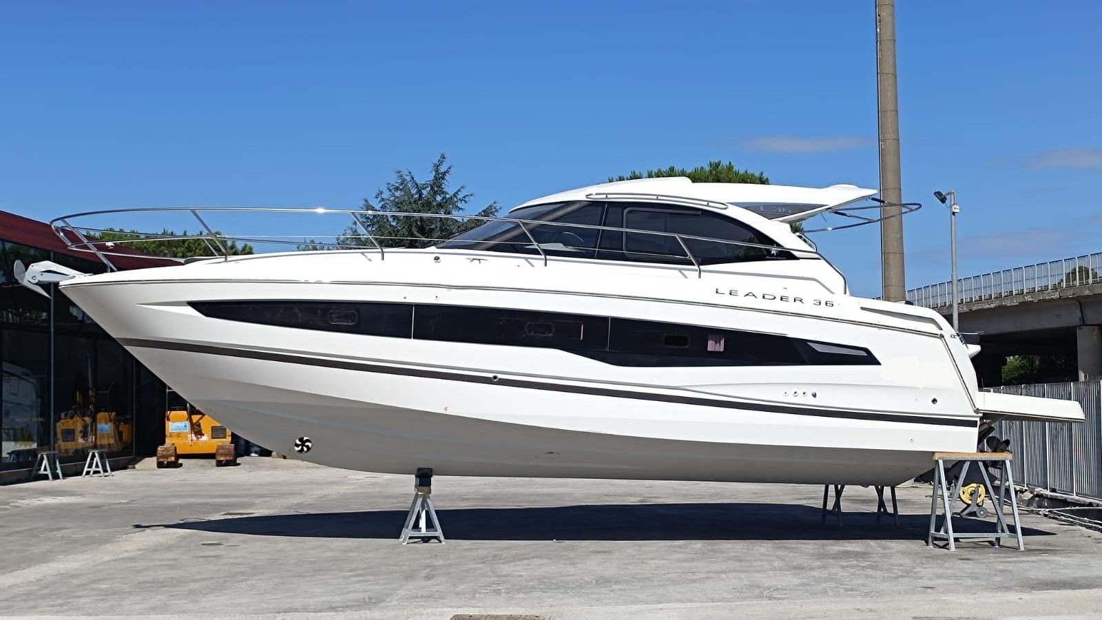 Jeanneau Leader 36 2020 Jeanneau Leader 36 yacht on stands, displayed outdoors under clear blue sky.