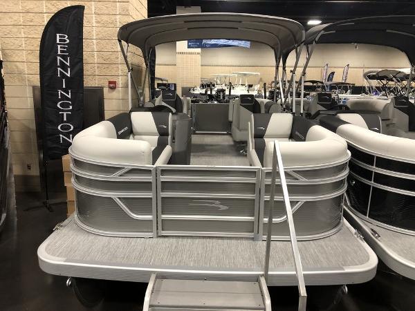 Bennington S Quad Bench 20 SSR 2025 Bennington S Quad Bench 20 SSR pontoon boat displayed indoors.