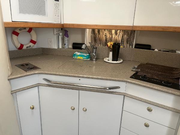 Formula 41 PC 1998 Formula 41PC yacht kitchen with modern appliances and sleek countertops.