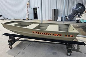 Tracker Grizzly 10 Jon 2026 Tracker Grizzly 10 Jon boat on display in a marina setting.
