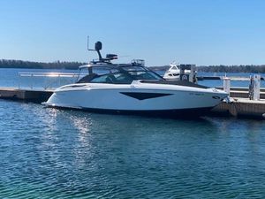 Cobalt A36BR 2020 Cobalt A36BR boat docked on a sunny day at a marina.