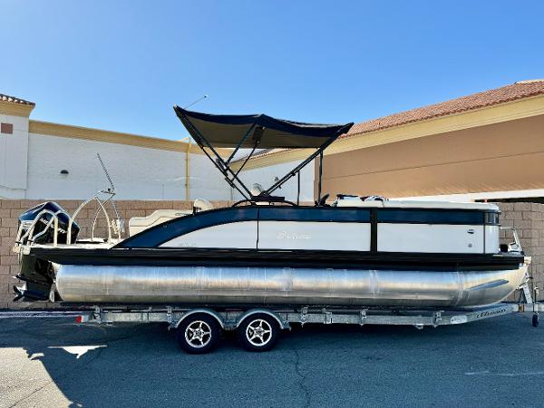 Barletta Cabrio E22UC 2020 Barletta Cabrio E22UC pontoon boat on trailer, parked outdoors.