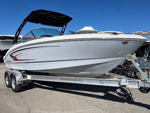 Chaparral 21 SSi OB 2024 Chaparral 21 SSi OB boat on trailer, sleek design, white exterior.