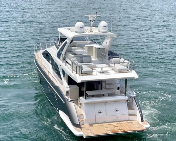 Azimut Fly 60 2024 Azimut Fly 60 yacht cruising on open water, showcasing luxurious design and spacious deck.