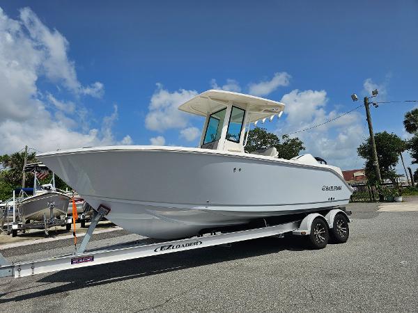 Sailfish 232 CC 2026 Sailfish 232 CC boat on trailer under clear blue sky.