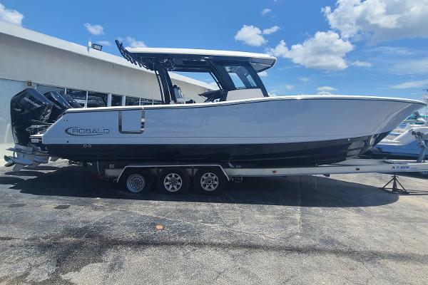 Robalo R360 2024 Robalo R360 boat on trailer under clear blue sky.