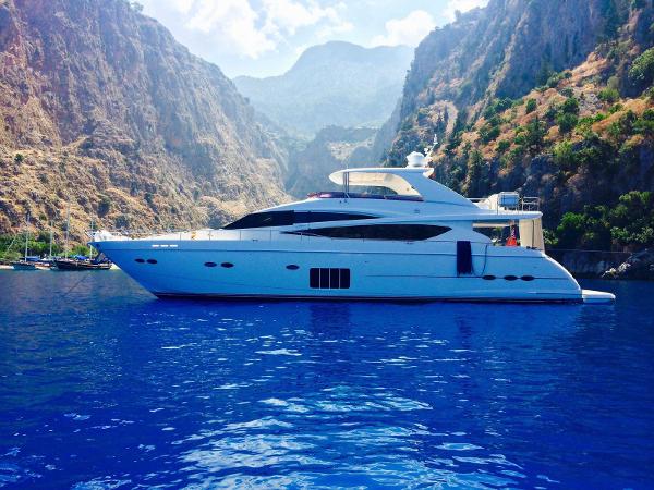 Princess 85 Motor Yacht Luxurious 2011 Princess 85 Motor Yacht cruising in scenic mountainous waters.