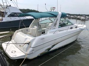 Sea Ray 290 Sundancer 1998 Sea Ray 290 Sundancer boat docked with green canopy and white exterior.