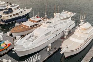 Custom Robinson - Aviator Luxury yachts docked at marina, featuring a 1945 Custom Robinson Aviator.
