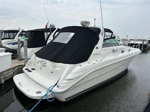 Sea Ray 330 Sundancer 1996 Sea Ray 330 Sundancer boat docked at marina, rear view with black cover.