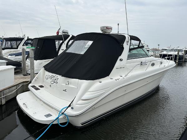 Sea Ray 330 Sundancer 1996 Sea Ray 330 Sundancer boat docked at marina, rear view with black cover.