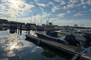 Grady-White Fisherman 257 Boats docked at a marina under a partly cloudy sky, featuring a 2017 Grady White 257 Fisherman.