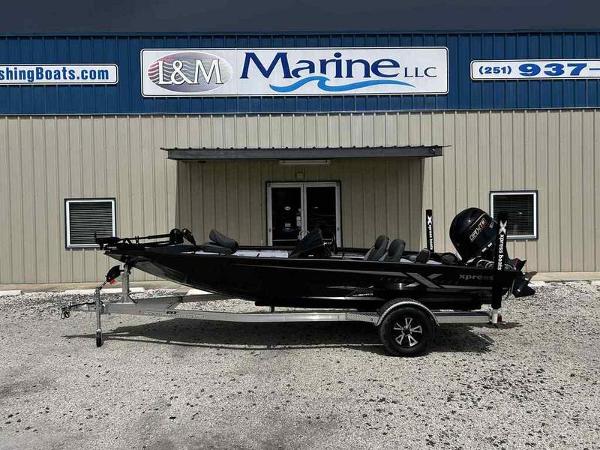Xpress H18B 2026 Xpress H18B boat on trailer outside L&M Marine LLC building.