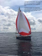 Viko s30 Cruiser Sailboat Viko s30 Cruiser 2025 with red and white spinnaker on open water.