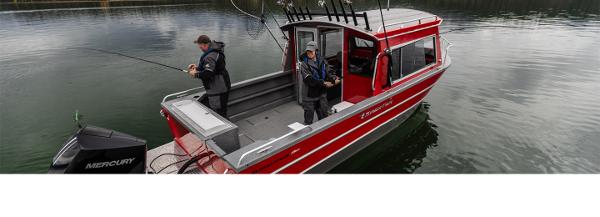 Spartan 240 Maximus Pro 2024 Spartan 240 Maximus Pro boat with anglers fishing on a calm lake.