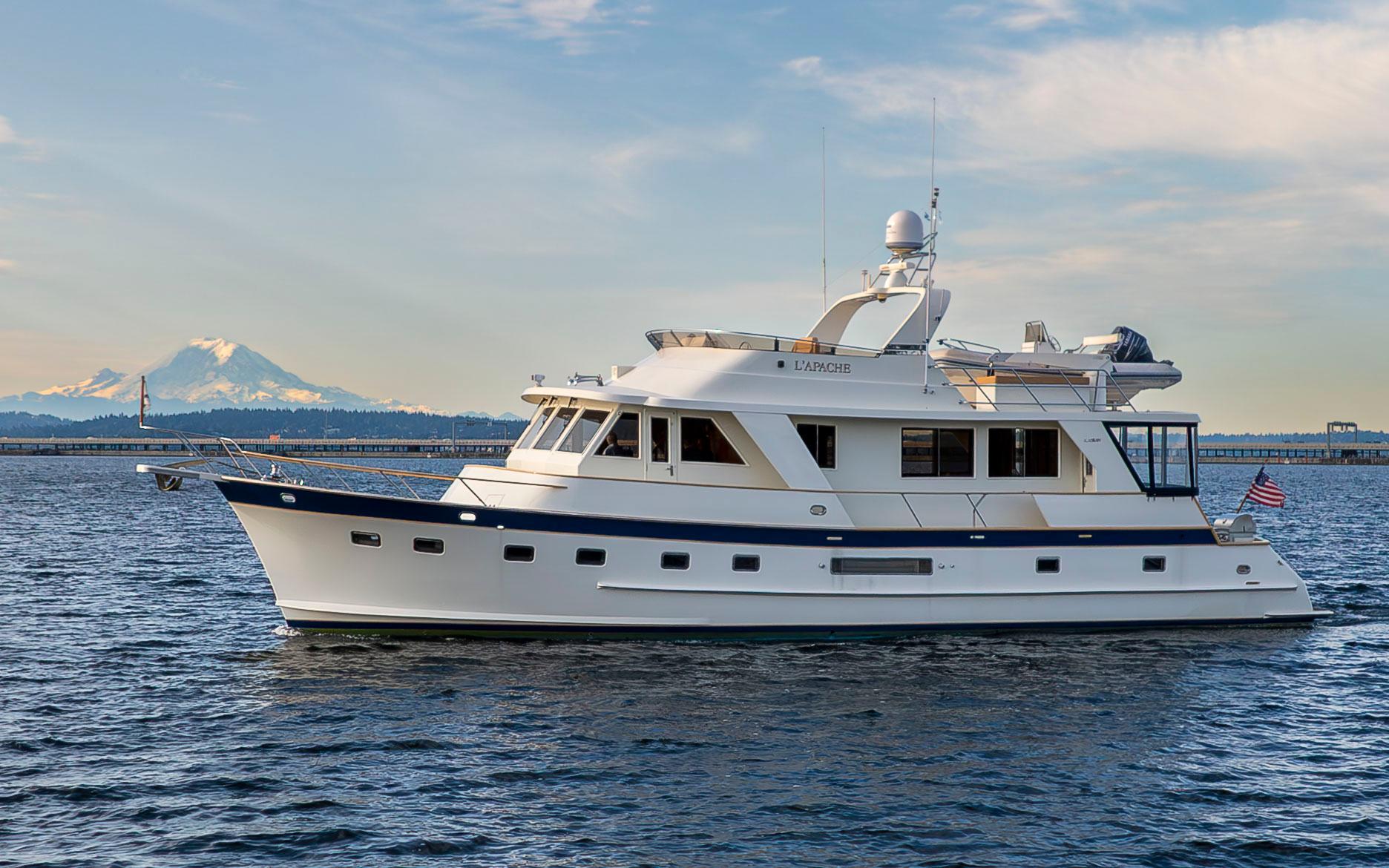 Alaskan 65 Flushdeck 2006 Alaskan 65 Flushdeck yacht on water with mountain backdrop.