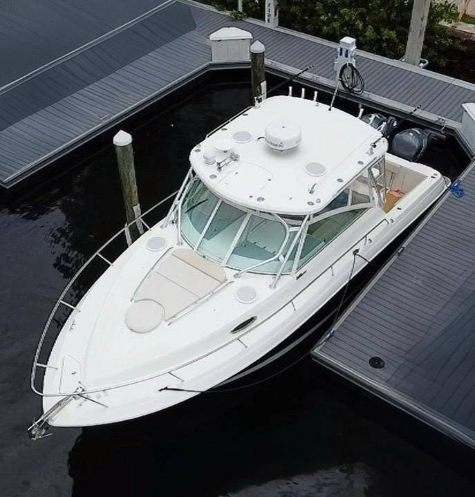 Wellcraft 340 Coastal 2014 Wellcraft 340 Coastal boat docked at marina, aerial view.