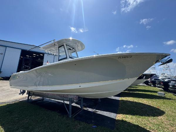 Sea Hunt Gamefish 27 Forward Seating 2022 Sea Hunt Gamefish 27 boat with forward seating, displayed outdoors under a clear sky.