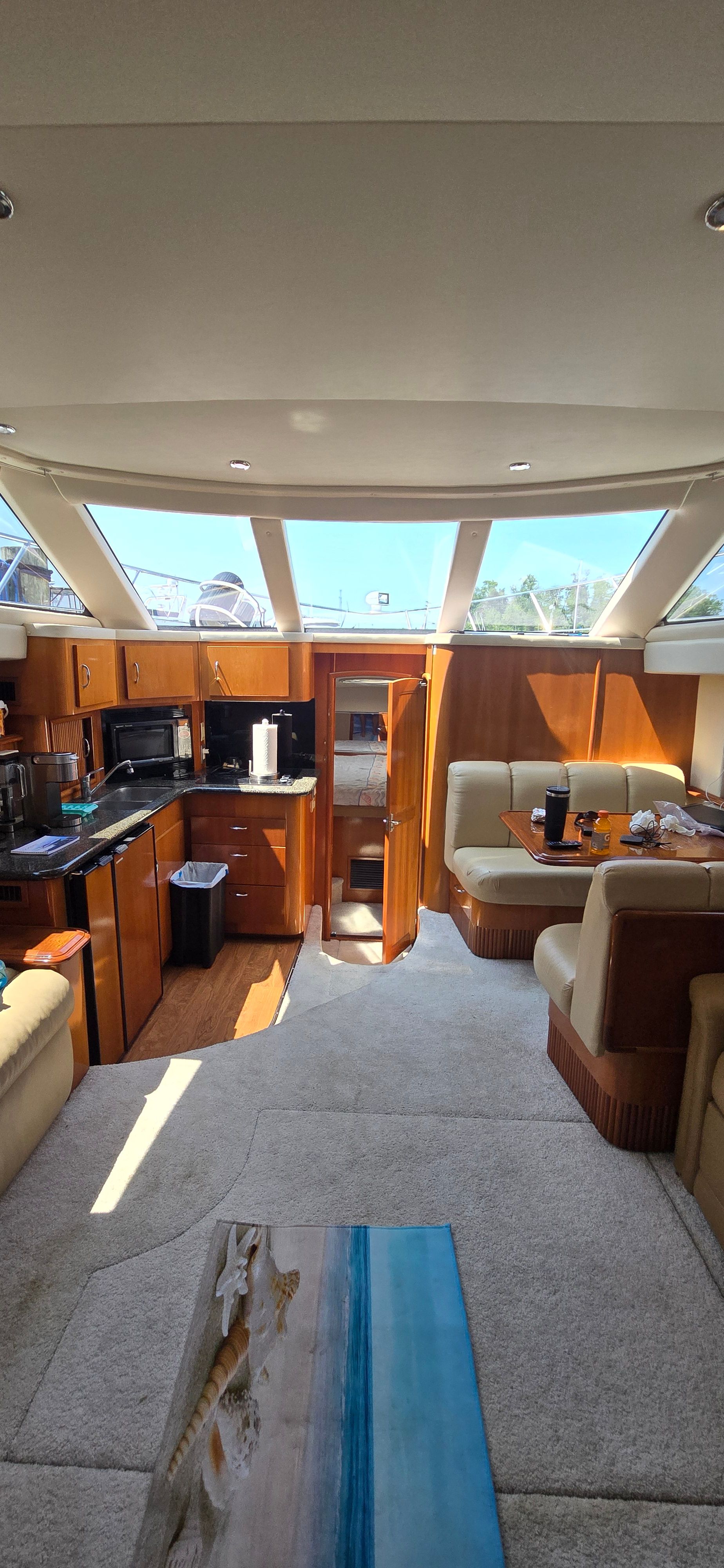 Carver CPMY w extended salon Luxurious 2006 Carver CPMY yacht interior with extended salon, featuring elegant seating and modern amenities.