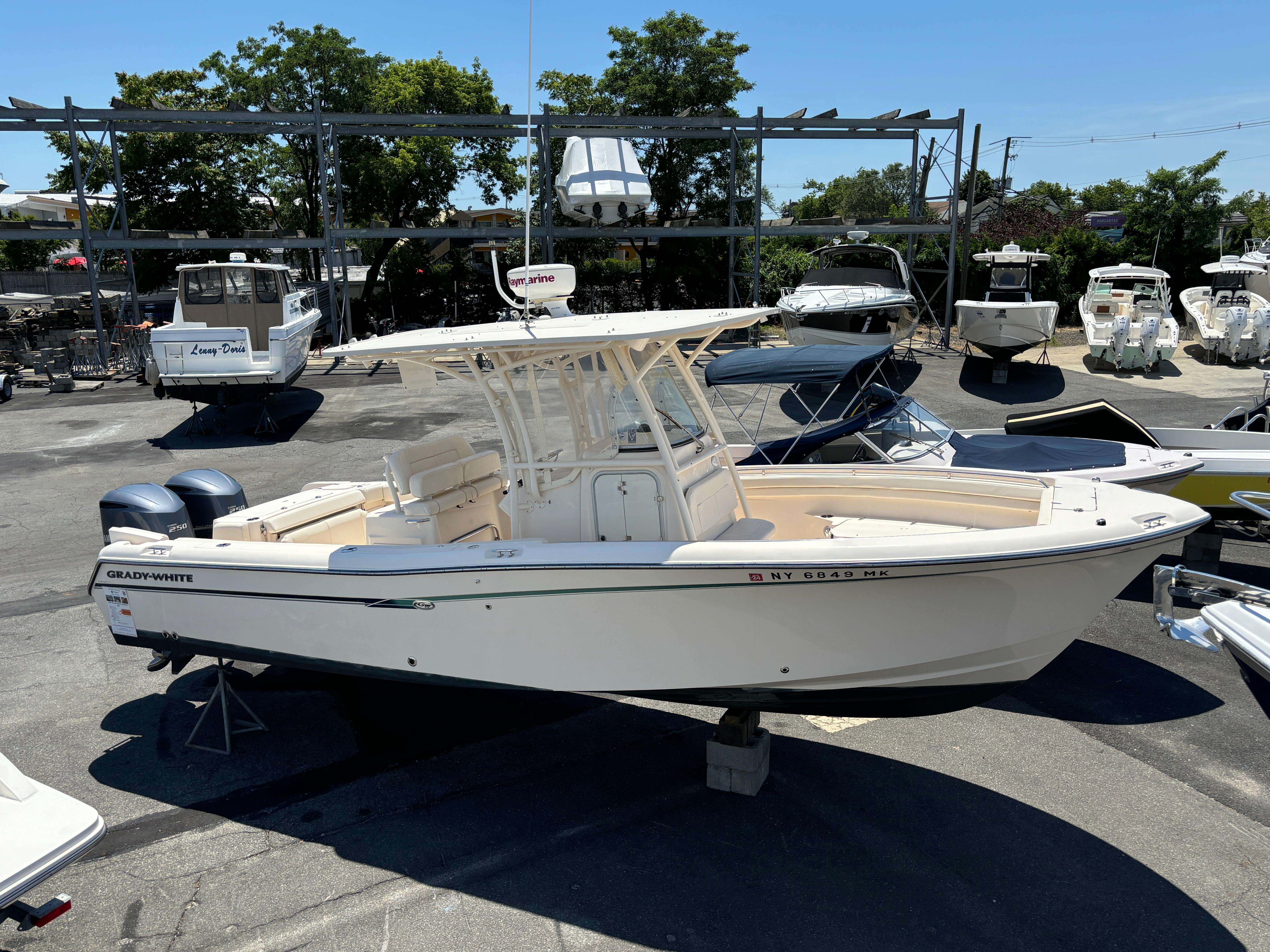 Grady-White Canyon 283 2015 Grady-White Canyon 283 boat in a marina, surrounded by other boats.