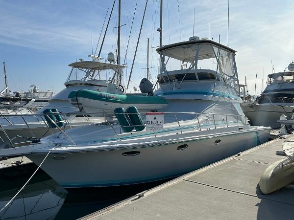 Trojan 12 Meter Convertible 1988 Trojan 12 Meter Convertible yacht docked at marina.