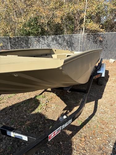 Edge Duck Boats 656 DB Sportsman 2025 Edge Duck Boats 656 DB Sportsman on trailer, outdoors, with autumn foliage background.