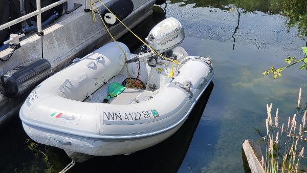 AB Inflatables Lamina 10 2014 AB Inflatables Lamina 10 boat docked with Honda outboard motor.