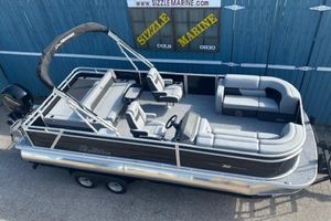 Sun Tracker Party Barge 22 RF DLX 2026 Sun Tracker Party Barge 22 RF DLX pontoon boat on trailer, at Sizzle Marine.