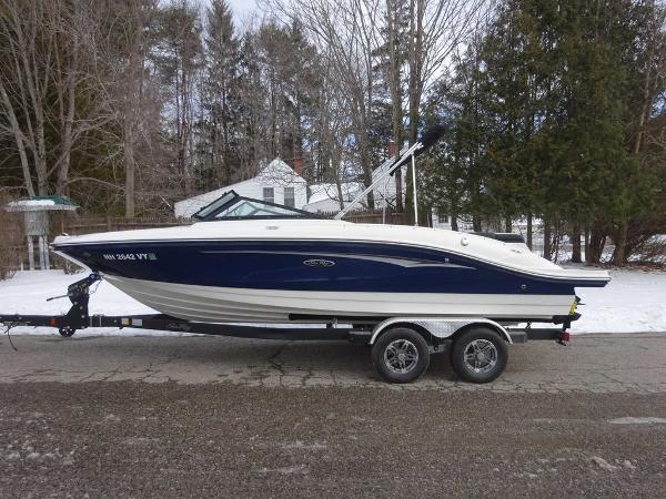 Sea Ray SPX 210 2023 Sea Ray SPX 210 boat on a trailer in a snowy setting.