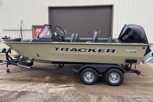 Tracker Targa V-19 Combo 2026 Tracker Targa V-19 Combo boat on trailer, parked outside a garage.