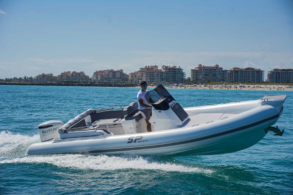 Sea Prop COMFORT 24 2025 Sea Prop COMFORT 24 boat cruising on the ocean near a coastal city.