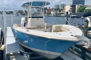 Sea Chaser 27 HFC 2019 Sea Chaser 27 HFC boat docked in a marina, featuring a sleek blue and white design.