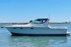 Tiara Yachts 3600 Open 1990 Tiara Yachts 3600 Open cruising on calm waters under a clear blue sky.