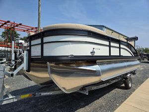 Harris Cruiser 210 2025 Harris Cruiser 210 pontoon boat on trailer, parked outdoors.