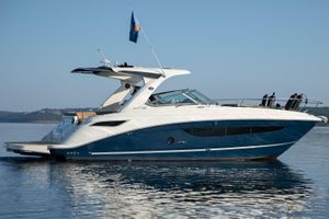 Sea Ray 350 Sundancer 2016 Sea Ray 350 Sundancer yacht on calm water, side view.
