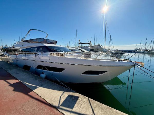 Ferretti Yachts 550 2022 Ferretti Yachts 550 docked in a sunny marina.